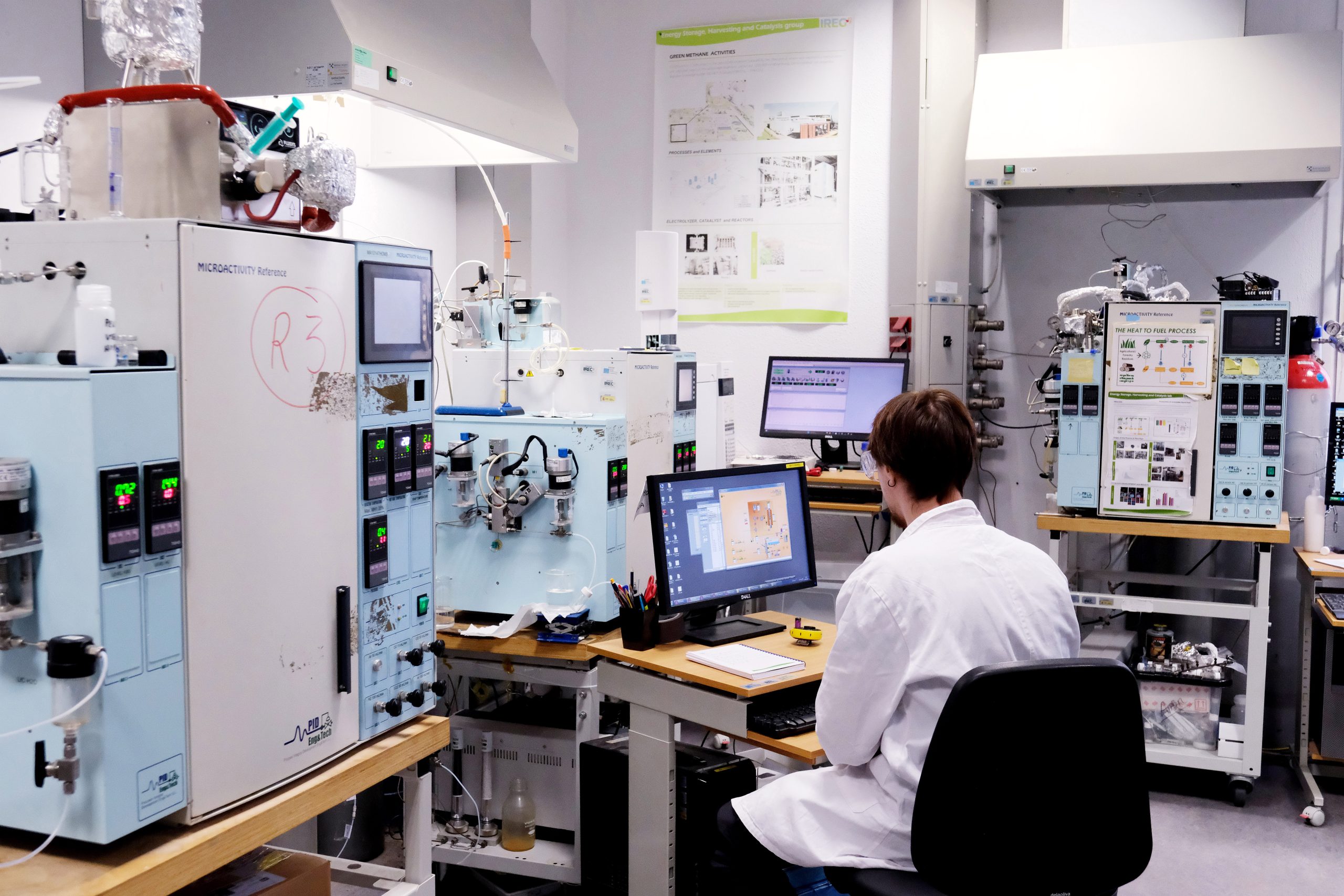 Scientist working in an energy research laboratory, illustrating advanced battery, electrochemistry and catalysis research with specialized equipment for energy storage and conversion studies.