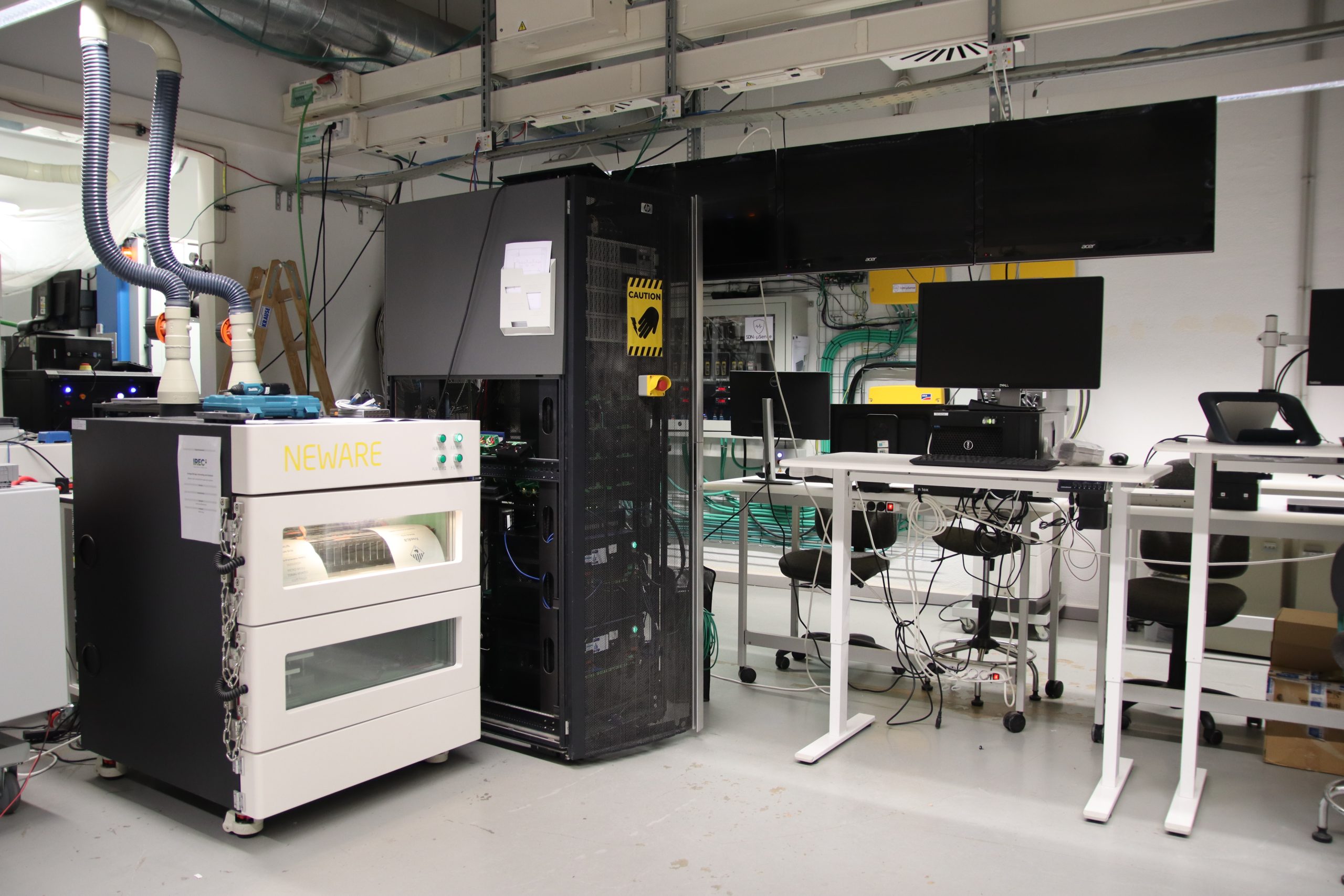 Energy research laboratory with advanced machinery and computers used for renewable energy analysis, power systems testing and smart grid technology development
