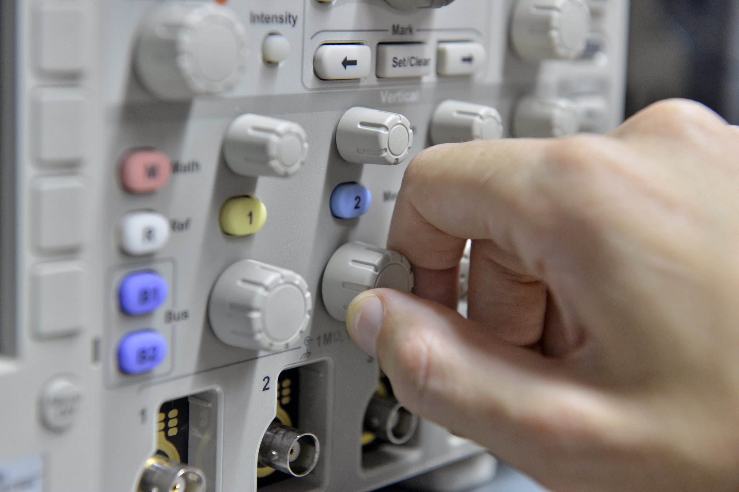 Control buttons on an electronic oscillator used in laboratory testing of energy storage systems, battery management analysis and power electronics research.