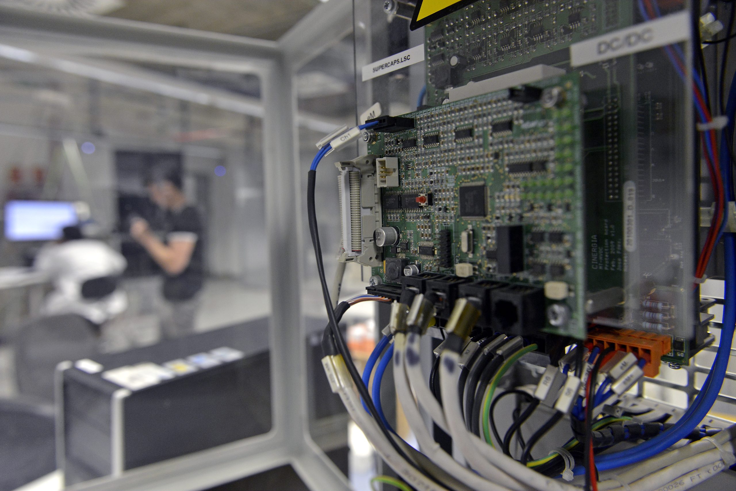 Electronic control board with connected cables in an energy research laboratory for power converter development, renewable energy systems testing and smart grid innovation