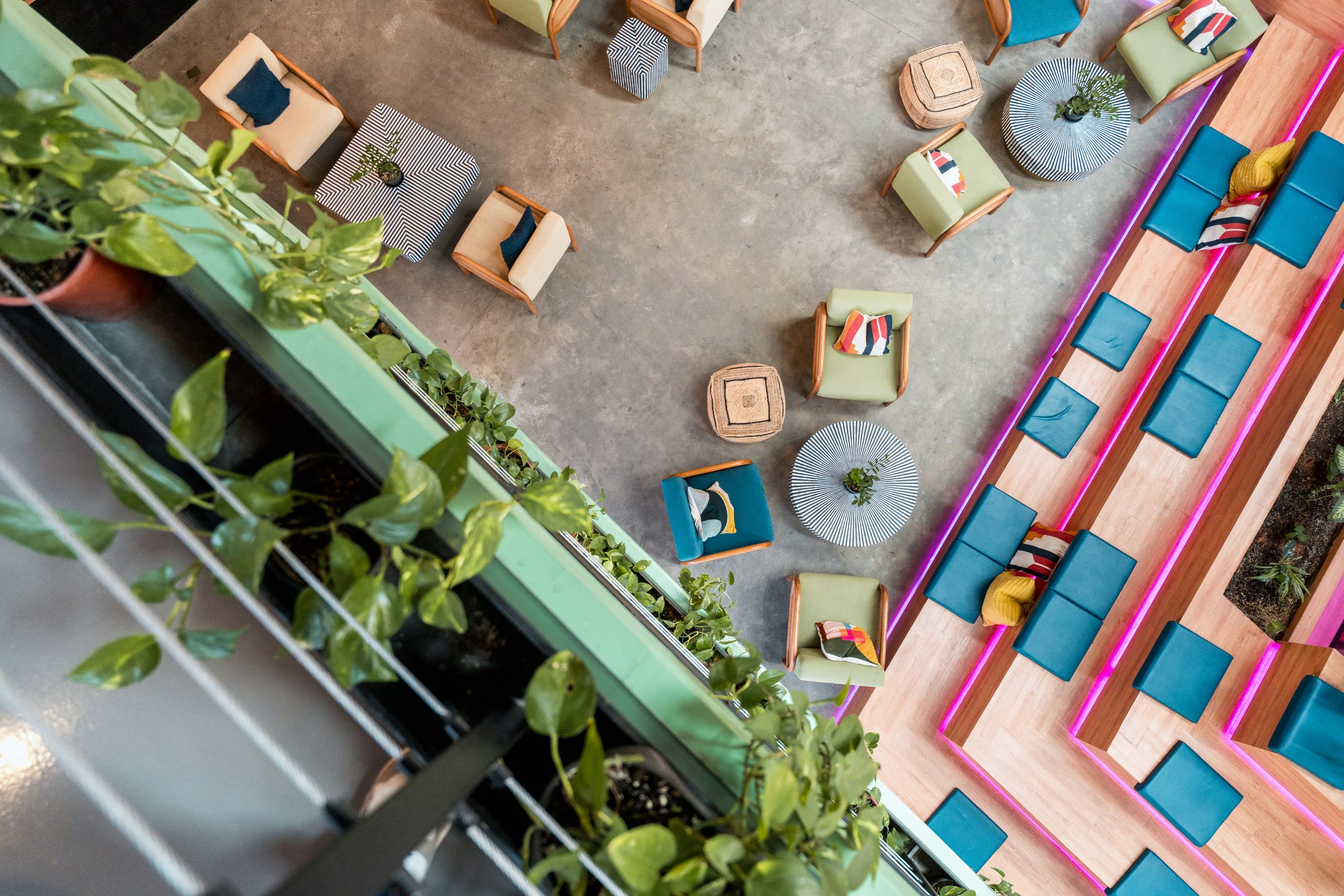 High-angle view of a creative lounge area, symbolizing the dynamic and efficient procurement processes that support IREC’s innovative ecosystem.
