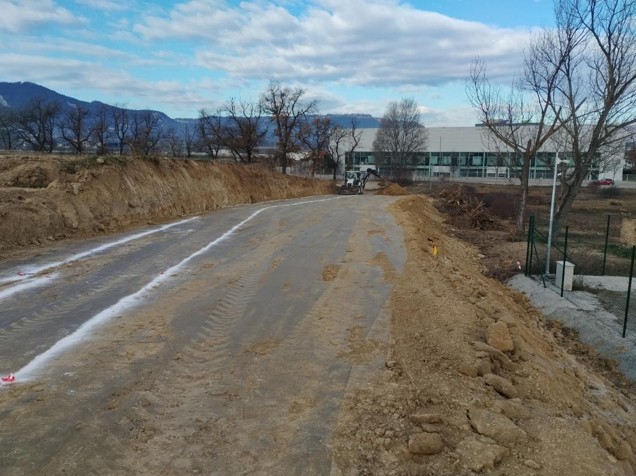 Road construction site with heavy machinery and ongoing infrastructure works