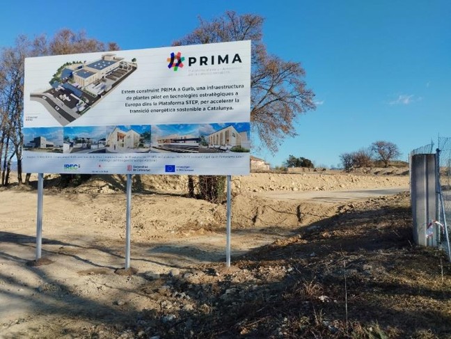 Construction site with earthworks and PRIMA facilities information sign